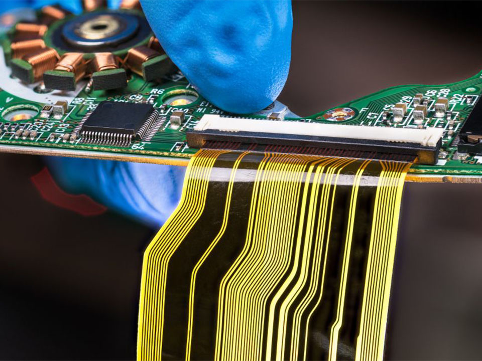 When does rigid-flex PCB cost justify the price premium vs using connectors